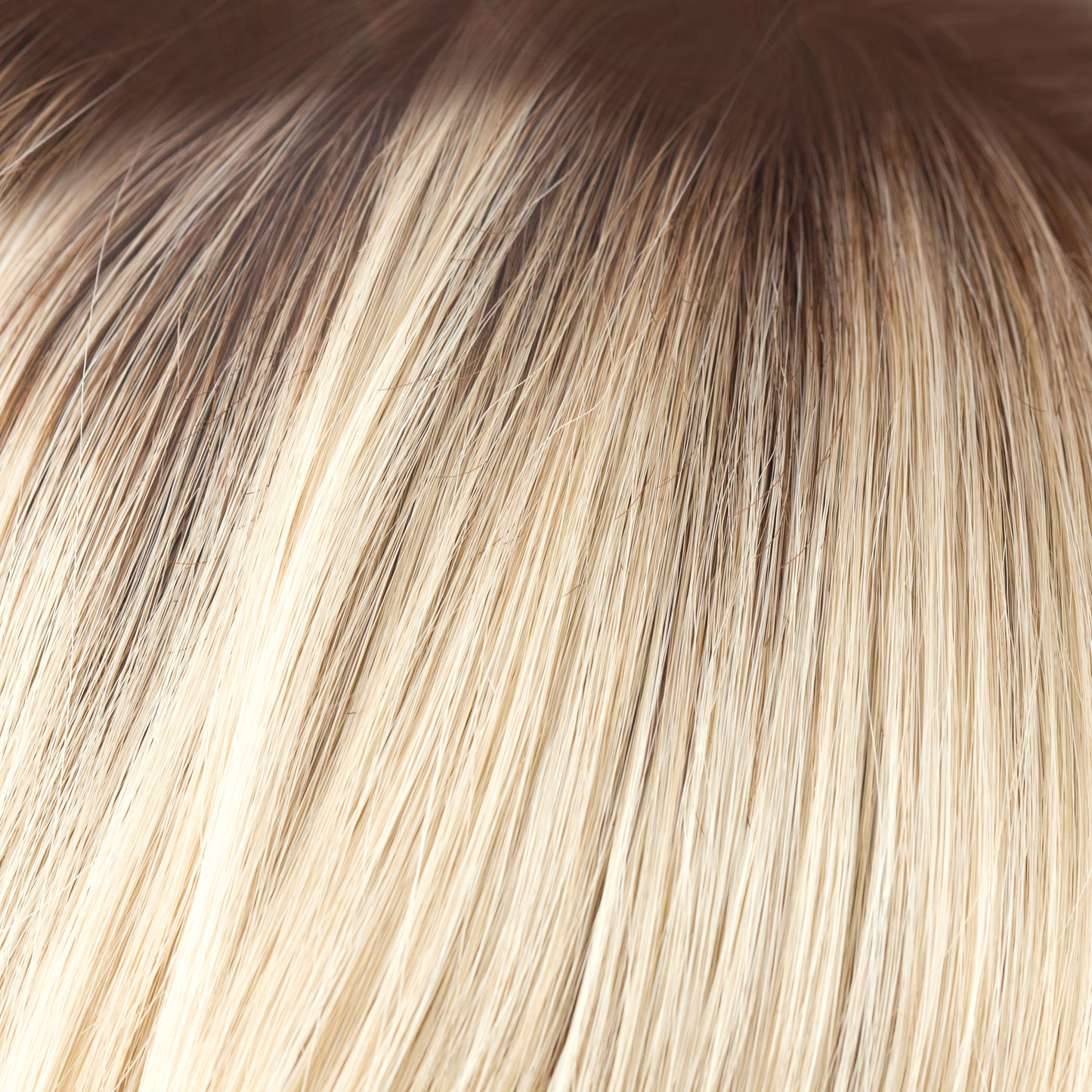 Champagne-R - A luxurious color with many fine tones of blond. Cream blonds, champagne hues and pale gold undertones make the blond a work of art! The medium warm brown root gives it the most natural of regrowths and keeps it looking very realistic.