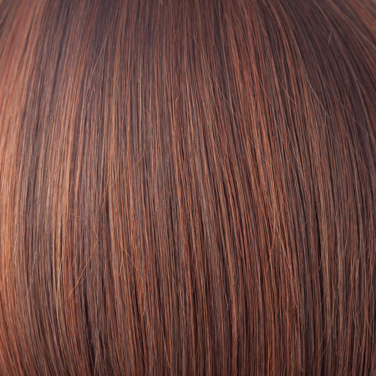 Chestnut - To make this color we have blended a multitude of medium brown red to make an unrivaled chestnut. Chesnut has a subtle twist of color blending slightly lighter towards the ends. It is understated, natural and complements all skin tones.