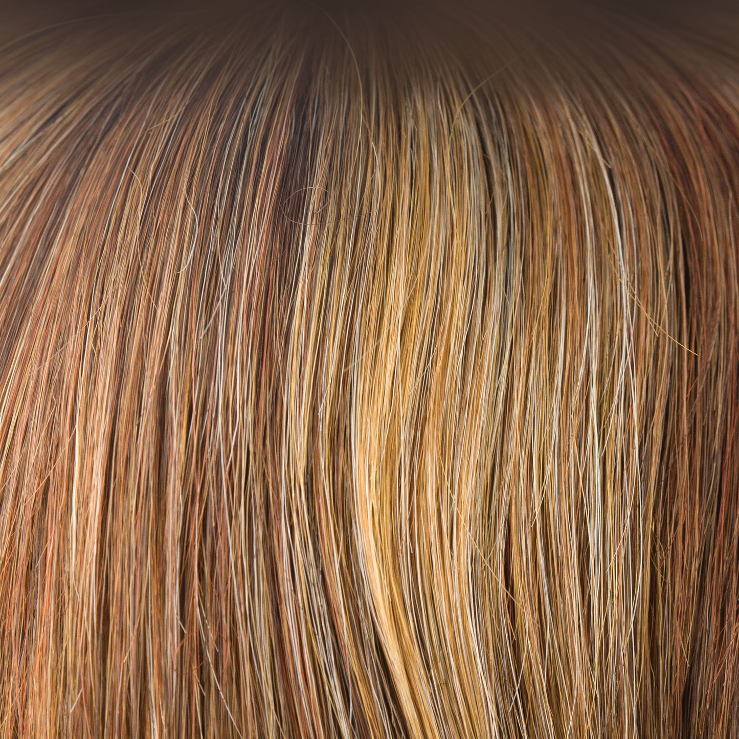 Copper Glaze-R - This rooted version of Copper Glaze has a regrowth of dark to medium amber brown and has honey gold blond highlights, scattering through to a medium copper brown. A much loved autumnal shade, this is both flattering and warm.