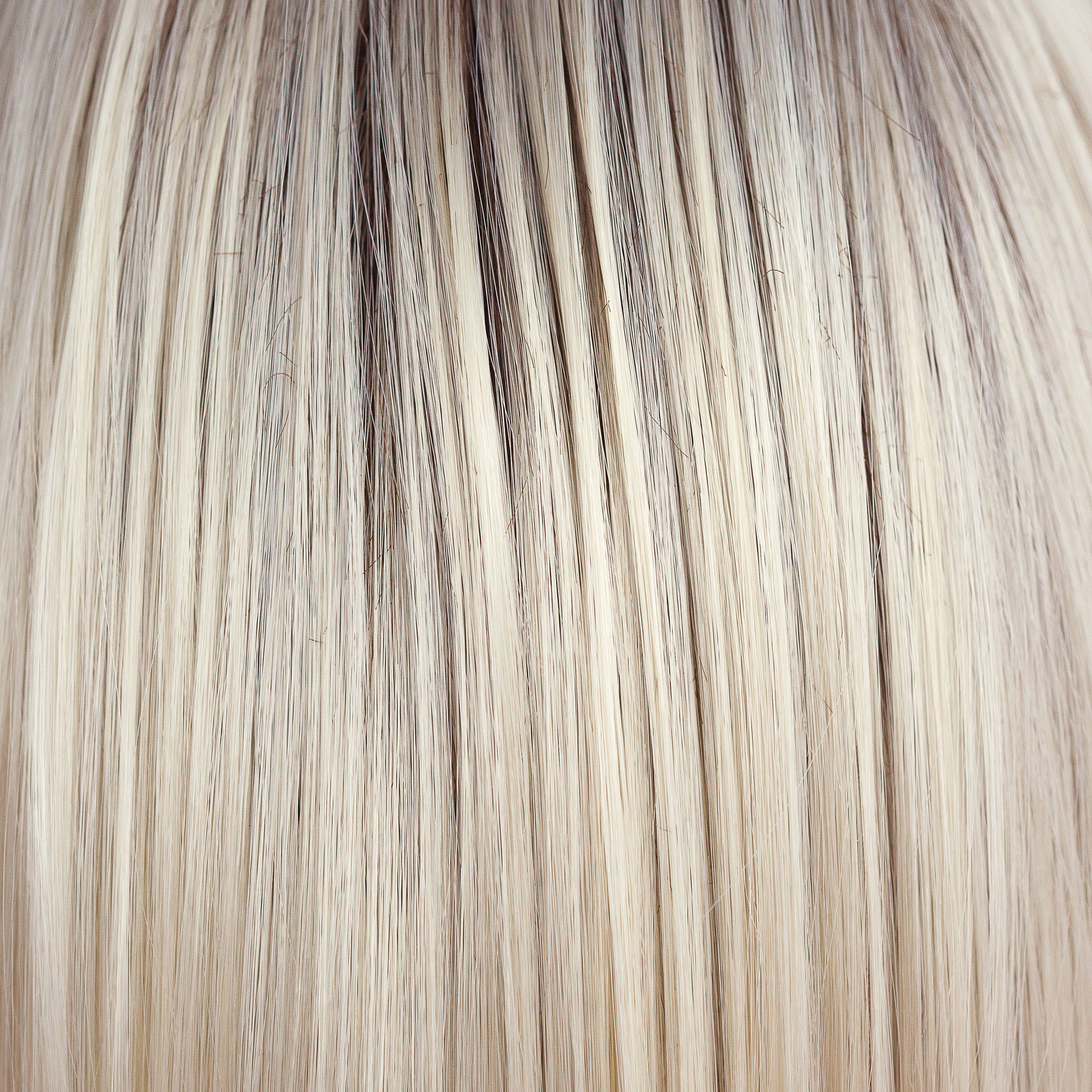 Coco Cream  -  A rich dark chocolate base that pushes the boundaries with its stunning displays of lily white chunky blond weaves and pale natural ash blond slices. Maximizing the impact of the style!