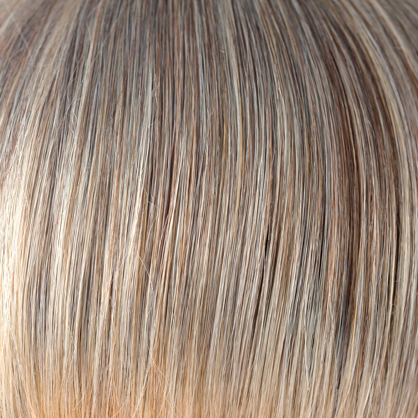 Frosti Blond  -  An ashy finely highlighted color, coming from a gentle root of dark blond. This is a very natural color, conservatively cool and sophisticated. Frosti Blond continues to wow us in any style!