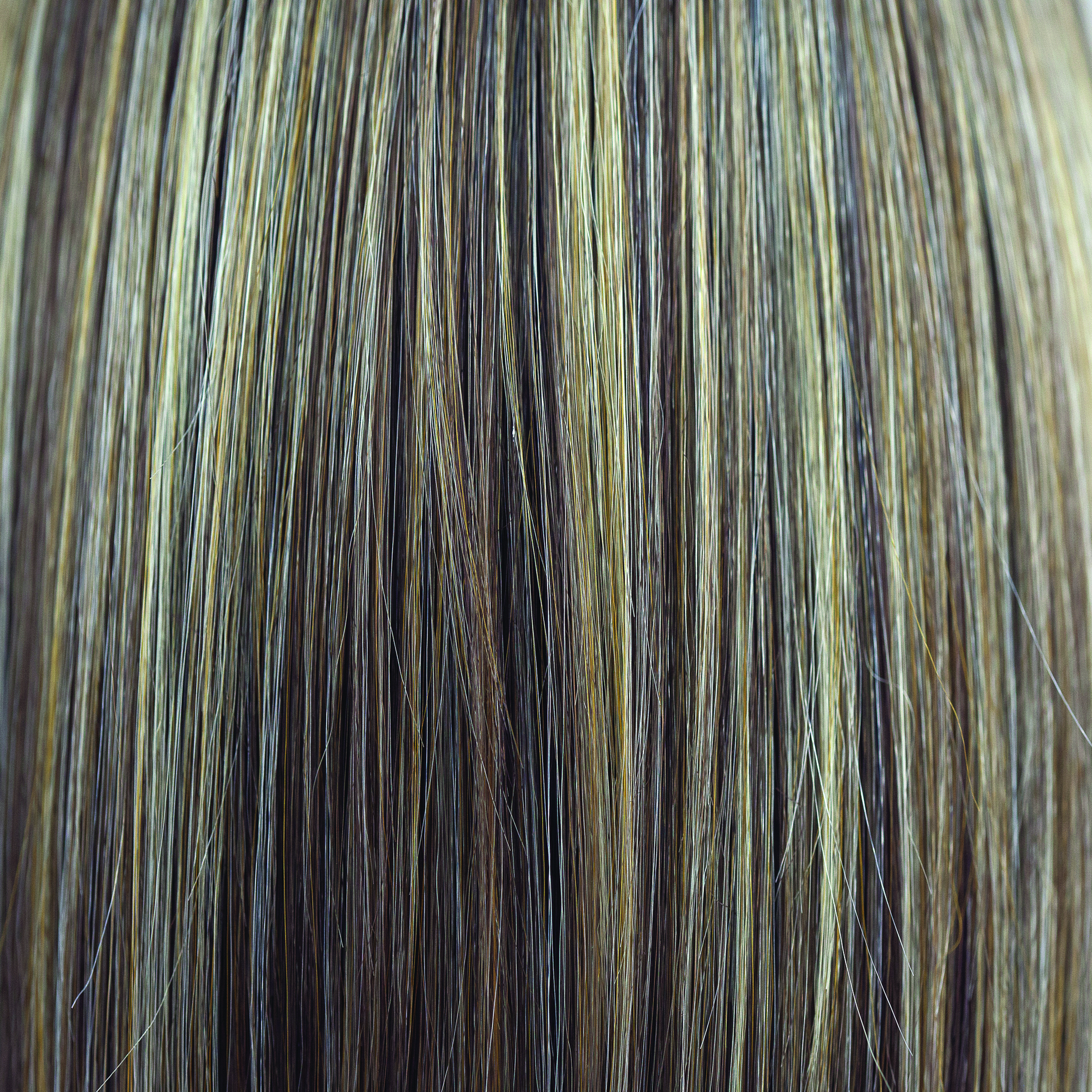 Peaches & Cream  -  A warm peach blonde base with creamy blonde undertone highlights. Highlights in a bright cream white blonde enhance the look, while a rich chocolate root regrowth adds depth and contrast.